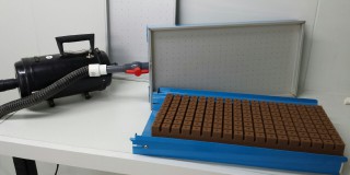 The E-Z Seeder with Smithers-Oasis Growing Medium in a template seed tray Image an EZ Seeder